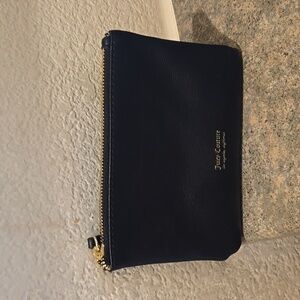 Juicy Couture black wristlet clutch Measures 6.75 Length 5 height 1 inch Depth